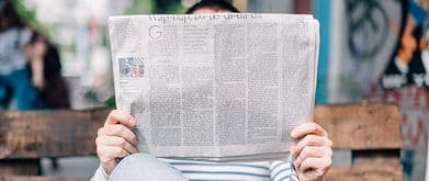 person reading a newspaper