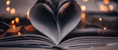 open book with pages making a heart