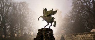 A pegasus statue in a park