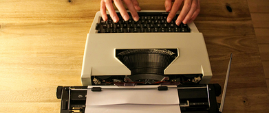 unknown author using typewriter