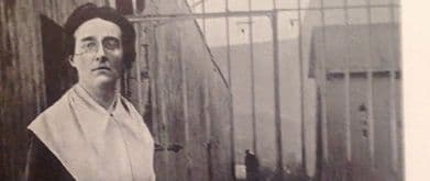 Louise Thuliez in front of jail bars