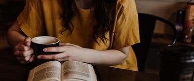 woman reading book about love