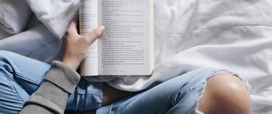 overhead shot of person holding book club book