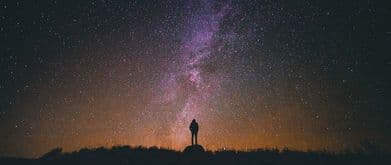 A man against the starry night sky