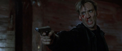 a photo of bloody nicolas cage holding a gun in 8MM